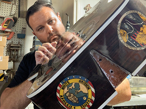 Josh Stotler showing off base of Apollo guitar