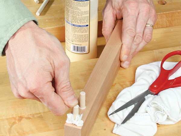 Using fabric to fill gap between dowel and wood