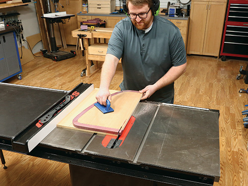 Using template as cutting guide for shaping back edge of shelf