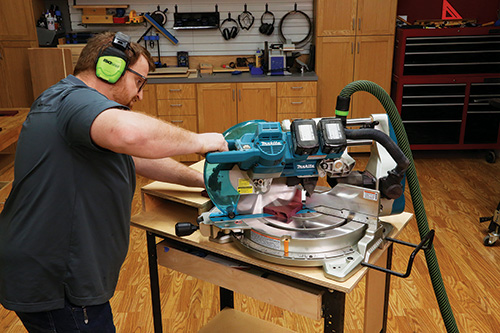 Using miter saw to cut shelf panels