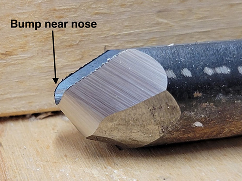 Woodturning gouge with a bump on its end