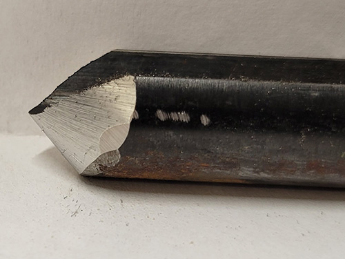 Side view of a woodturning gouge with a rolled-over wing