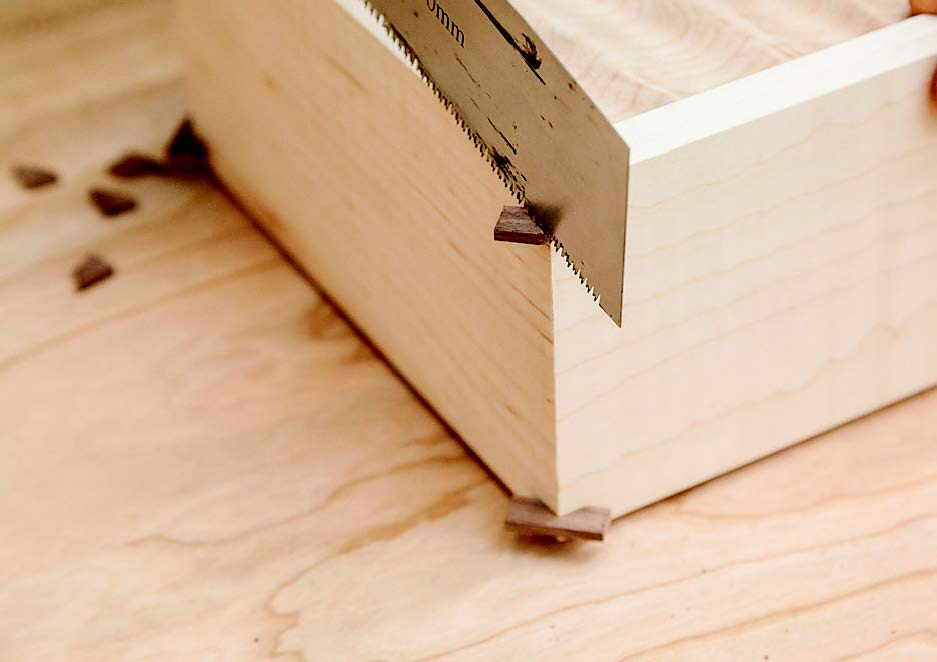 He then trimmed them flush when the glue dried.