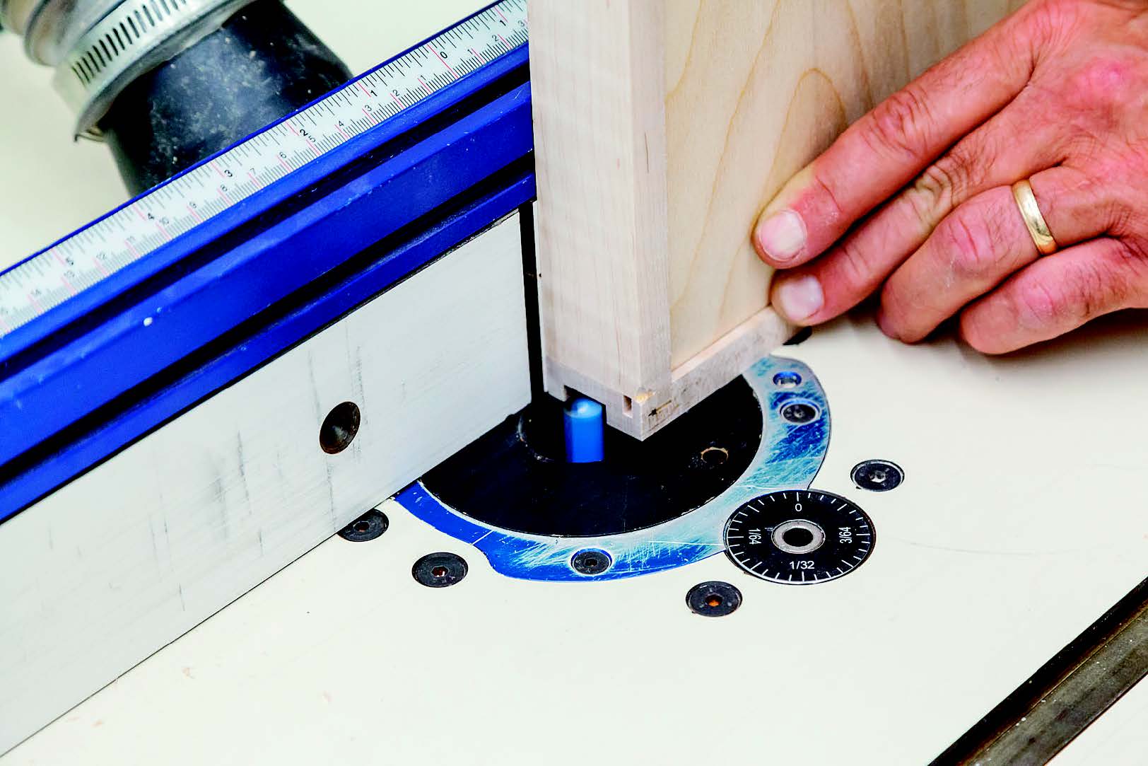 A wide groove cut into the outside face of each drawer box side hangs the drawer on the slide hardware. Mill these cuts with a straight bit in the router table or at the table saw with a dado blade.