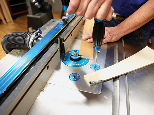 Testing router bit location for cutting divider groove