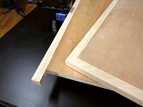 Close-up on cut and pre-trimmed hardwood edging on plywood panel