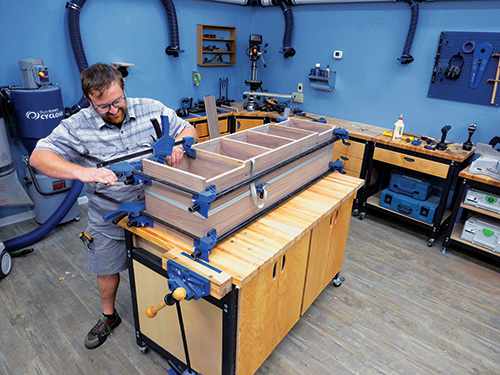 Using strap clamps to hold wall cabinet parts together during glue-up