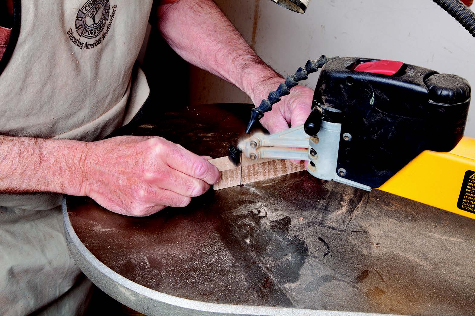 It’s easiest to cut your whistle’s holes before turning. One hole is for the lanyard (the Swedish versions shown were made by Susan Conover). A scroll saw leaves the tone generator hole with a smooth finish.