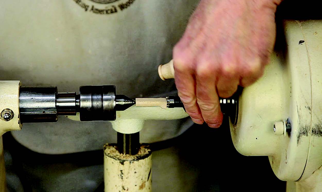 The author chucks a 11⁄4”-long blank off-center to turn the 3/8”-diameter fipple with the flat spot in it. The finished fipple will be 3/4” long: the author cuts off the extra length once he knows the whistle works.