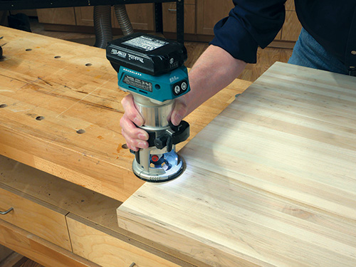 Trimming edges of butcher block piece for sanding cart tabletop
