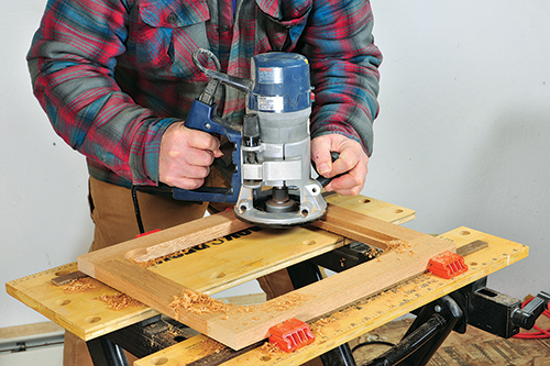 Rout the inside edges of a frame opening with a piloted rabbet bit.